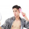 42379114 - man brushing his hair